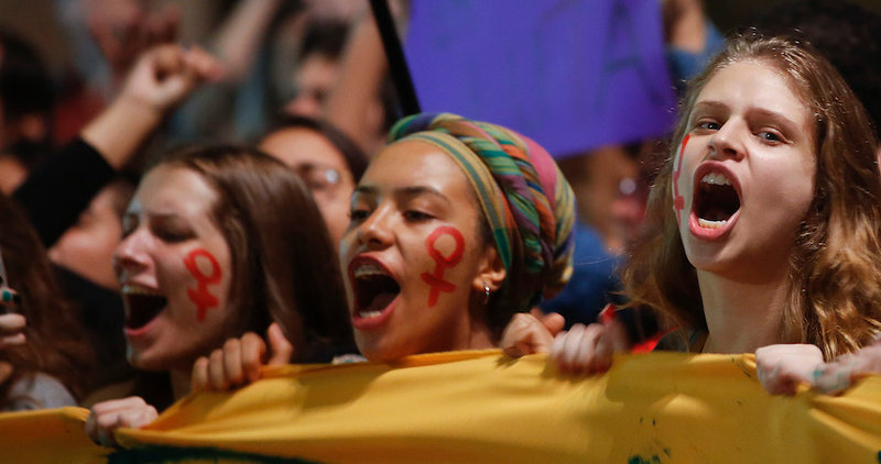 Women protest against acting President Temer, and in support of suspended President Rousseff, in Sao Paulo on May 17. Image via AP.